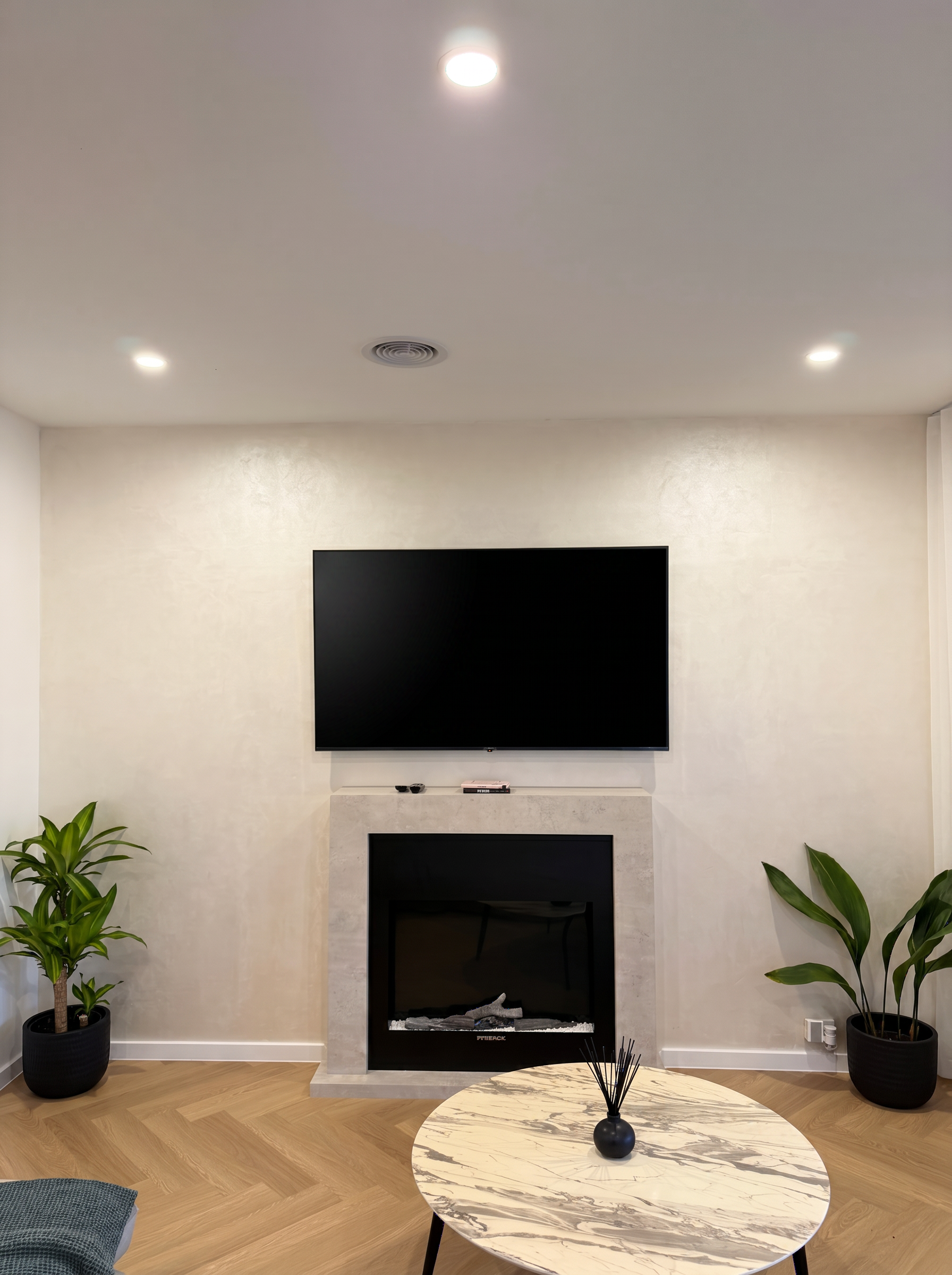 Ivory Venetian plaster fireplace feature wall, Melbourne residence